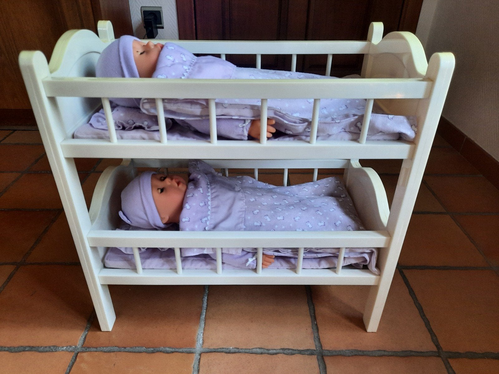 stapelbed met popjes, Ophalen