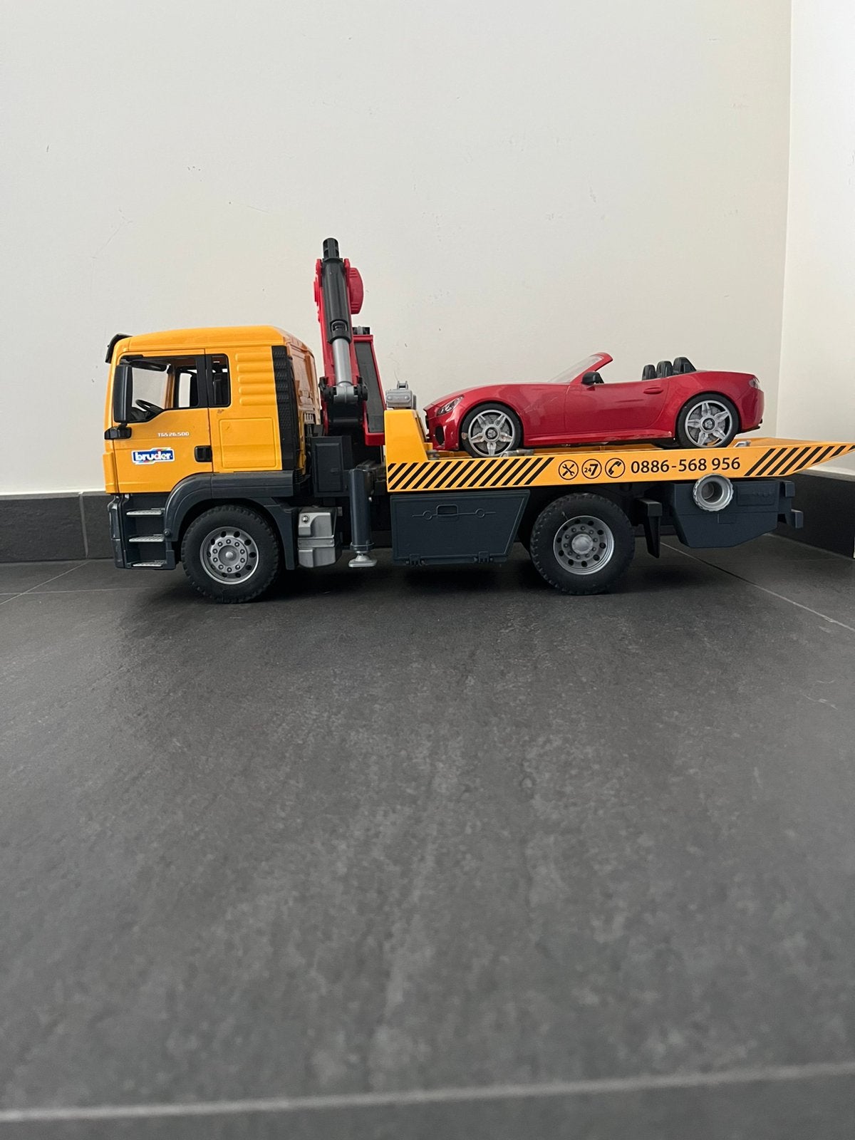 Bruder takelwagen met auto, Ophalen