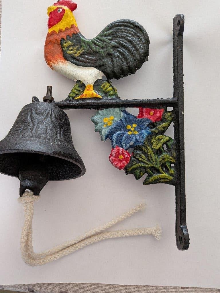 Gietijzeren wandbel haan- en bloemmotief, Ophalen