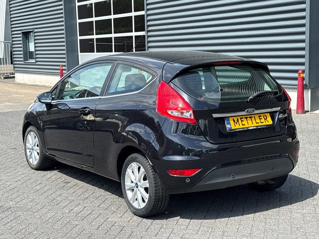 Ford Fiesta 1.4 Titanium | airco | cruise control, Voorwielaandrijving, Gebruikt, 4 cilinders, Zwart