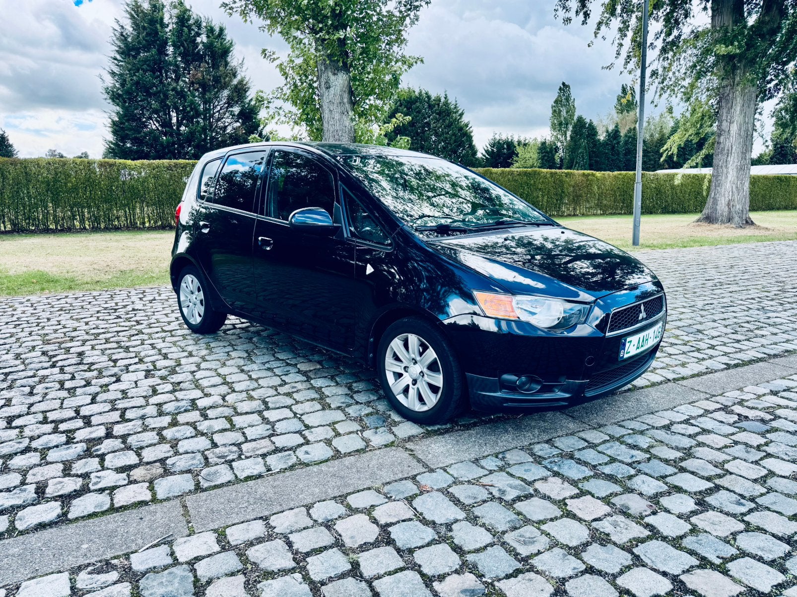 Mitsubishi Colt 1.3 benzine 73.000 km Airco, Zwart, 4 cilinders, Lichtsensor, Leder