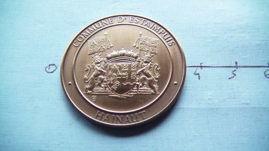médaille numismatique estaimpuis 1986, Enlèvement