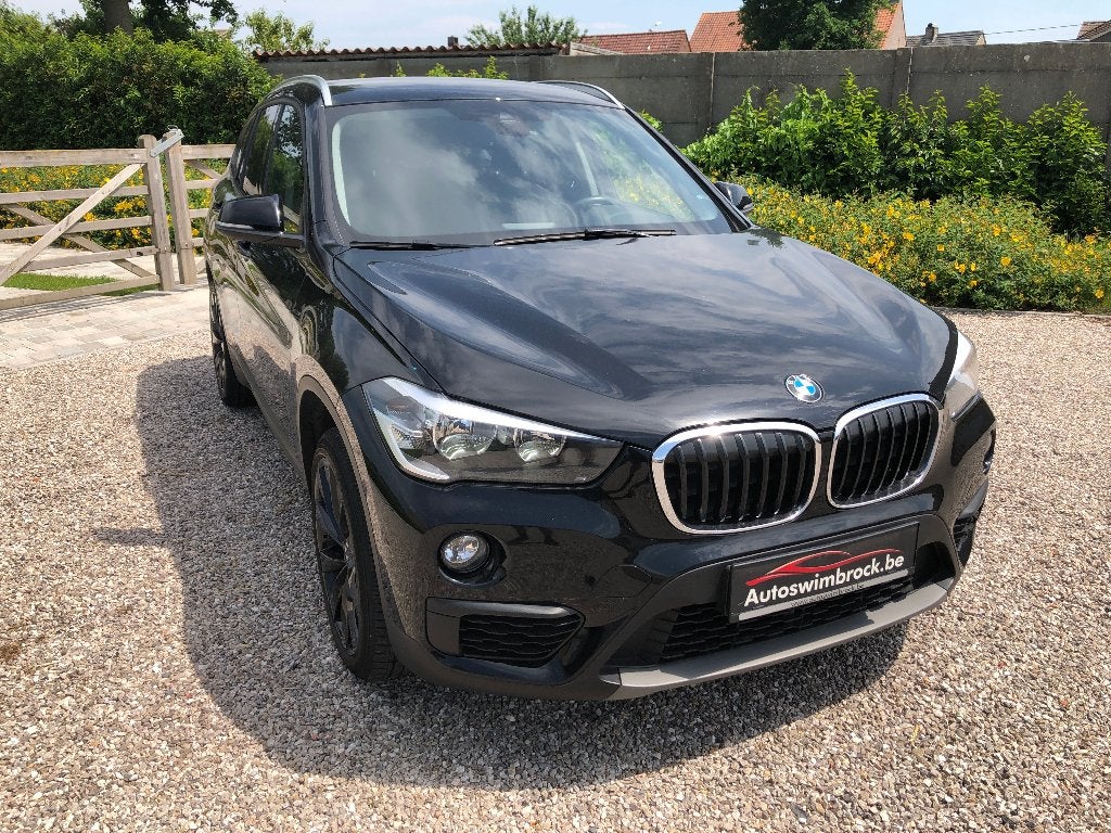 bmw x1 benzine automaat met garantie, Zwart, Bedrijf, 5 zetels, 5 deurs