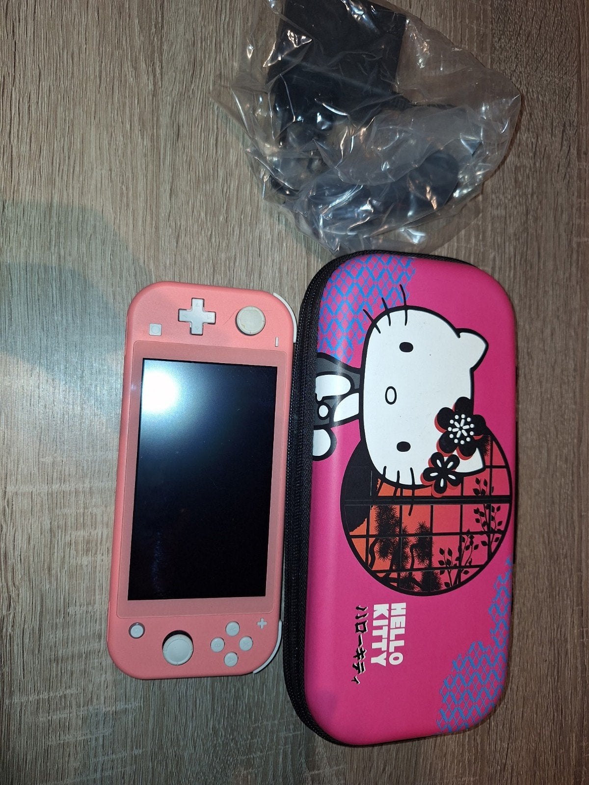 Nintendo Switch Lite Roze met Hello Kitty case, Ophalen, Roze of Coral, Gebruikt, Met beschermhoes of tas