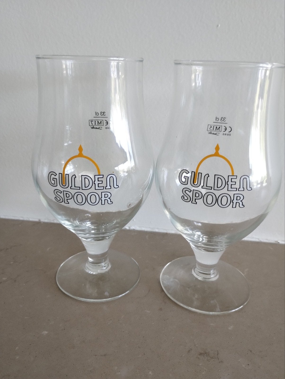 2 glazen Gulden Spoor, Ophalen