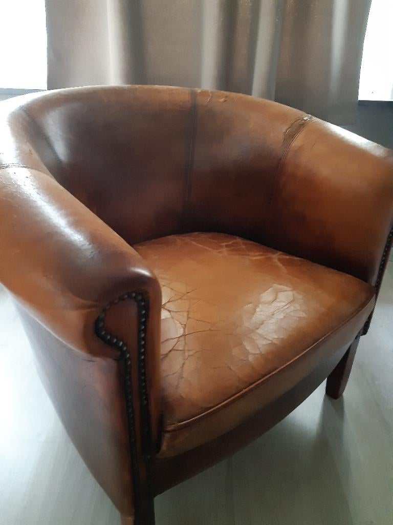 Oud schapenleren fauteuil, Ophalen