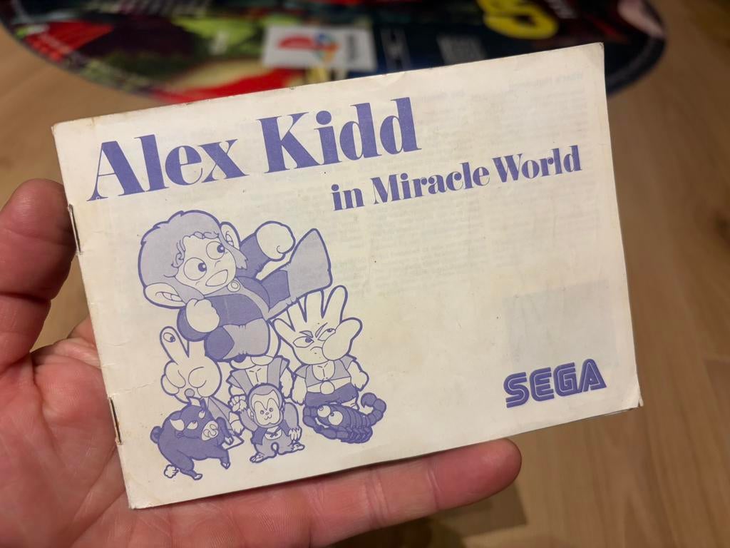 Boekje alex kidd in miracle world, Games en Spelcomputers, Games | Sega, Ophalen