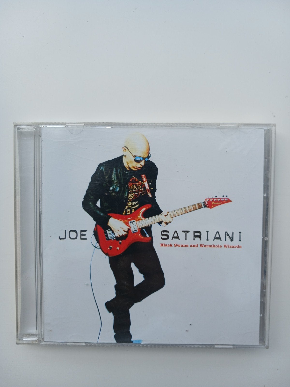 CD Les cygnes noirs et les sorciers vortex de Joe Satriani, Enlèvement ou Envoi