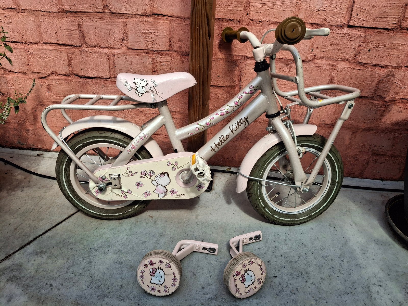 meisjesfiets 12inch met steunwieltjes, Ophalen, Zijwieltjes, Gebruikt, Velgrem
