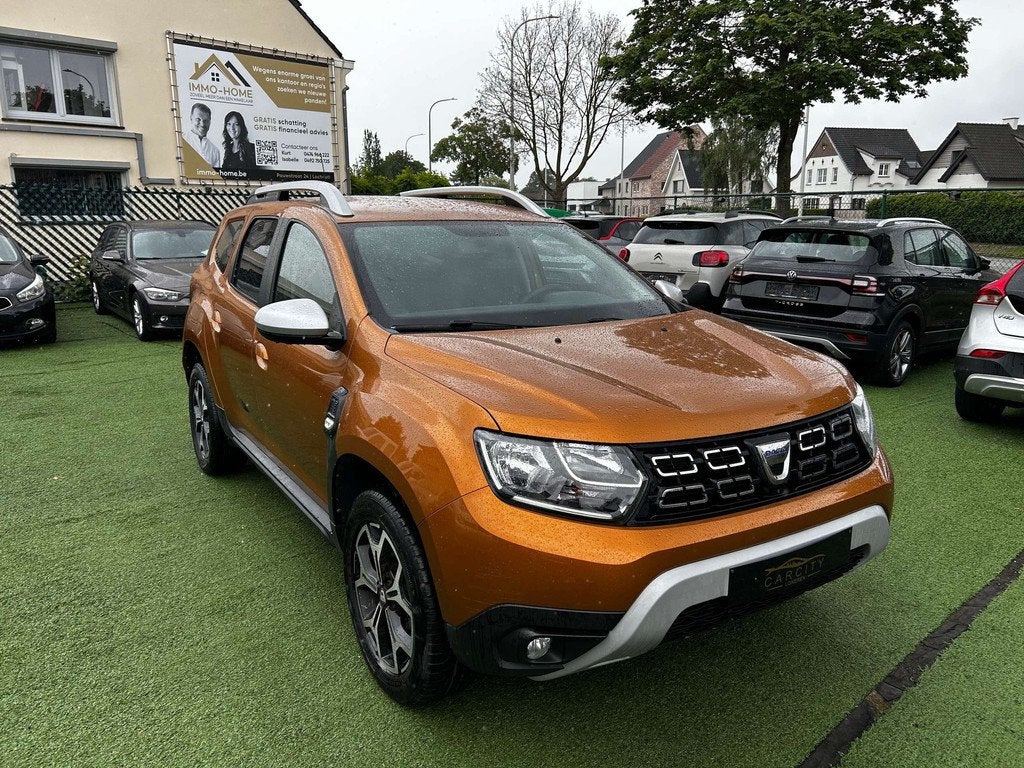 Dacia Duster 1.3 TCe 4X4 Prestige CARPLAY  CAMERA GPS, Auto's, 1849 kg, Stof, Gebruikt, 4 cilinders
