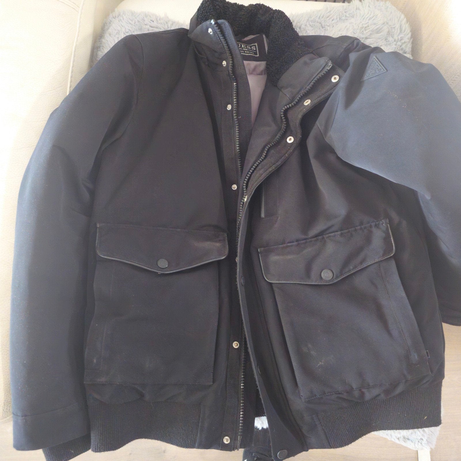 Winterjas heren guess, Ophalen