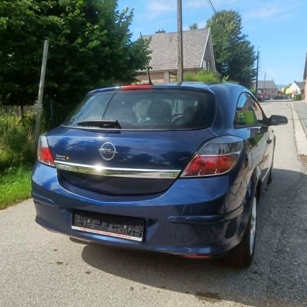 Opel Astra GTC 1.4i Airco, Auto's, Stof, Zwart, 4 cilinders, Blauw