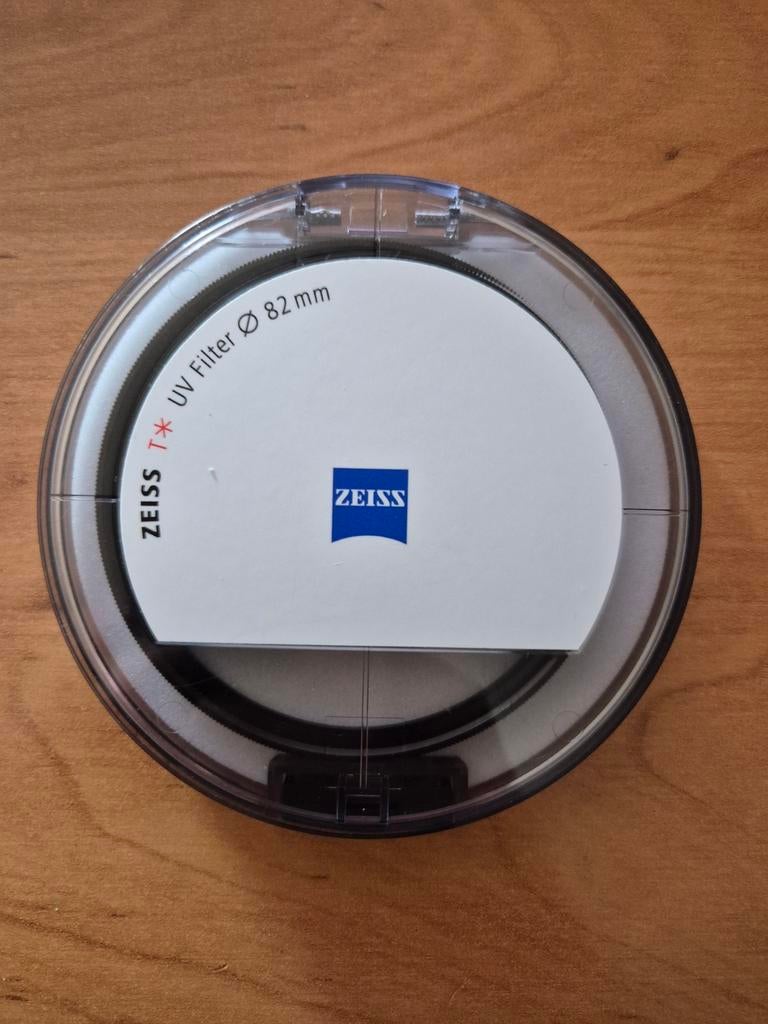 Filtre UV ZEISS T* 82 mm, TV, Hi-fi & Vidéo, Photo | Filtres, Autres marques, Enlèvement ou Envoi, Comme neuf, 80 mm ou plus