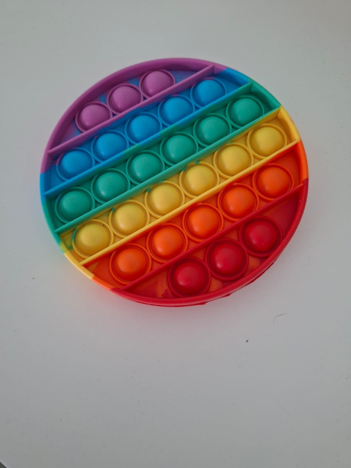Fidget regenboog pop it, Ophalen