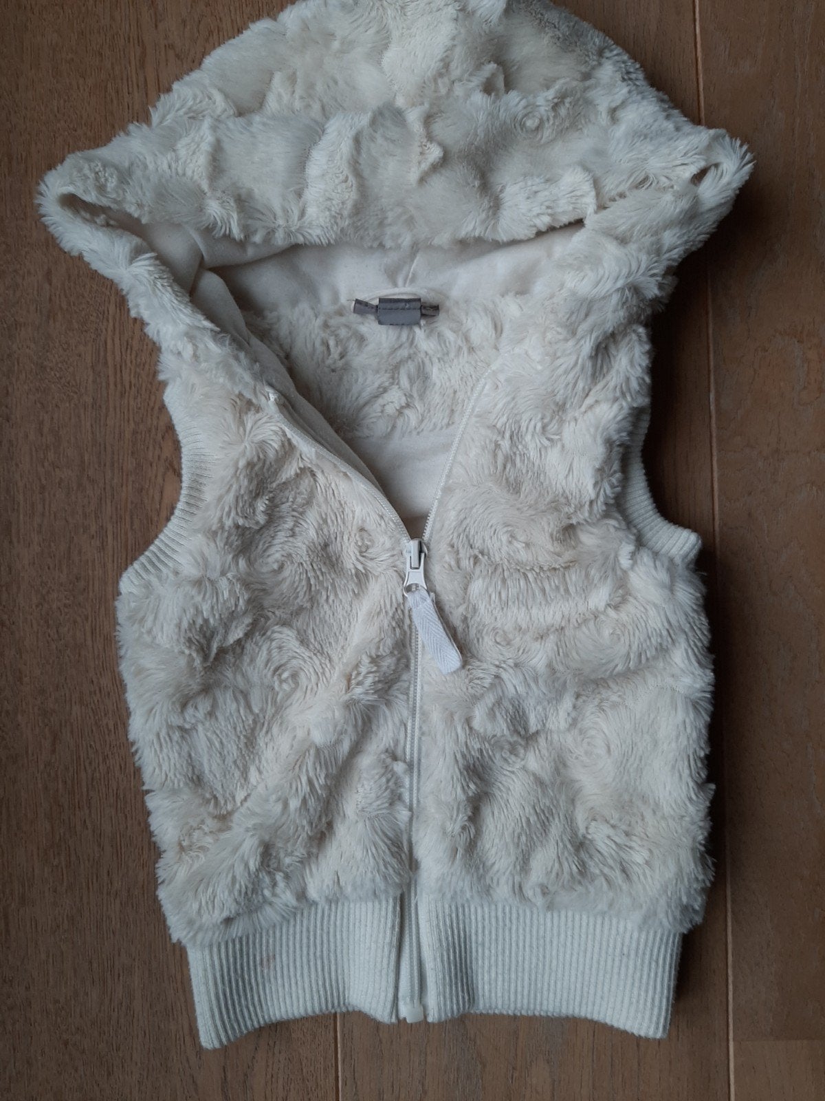 Bodywarmer faux fur, Ophalen