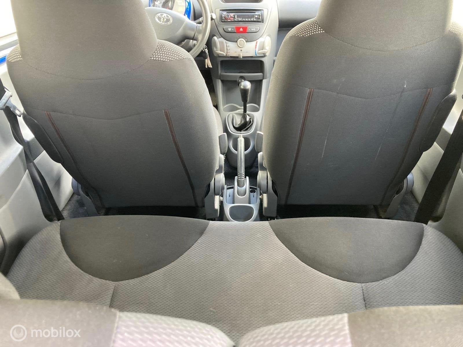 Toyota Aygo 1.0-12V 3-DEURS AIRCO APK tot 24/09/2027, Auto's, Stof, Blauw, 348 kg, Handgeschakeld