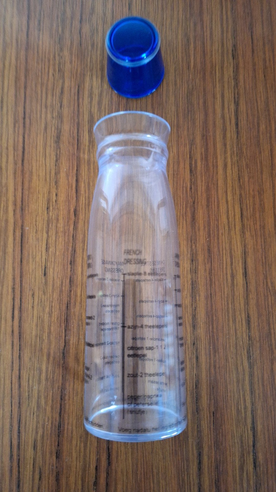 Shaker à vinaigrette avec texte néerlandais nouveau., Neuf, Enlèvement ou Envoi, Autres types, Plastique