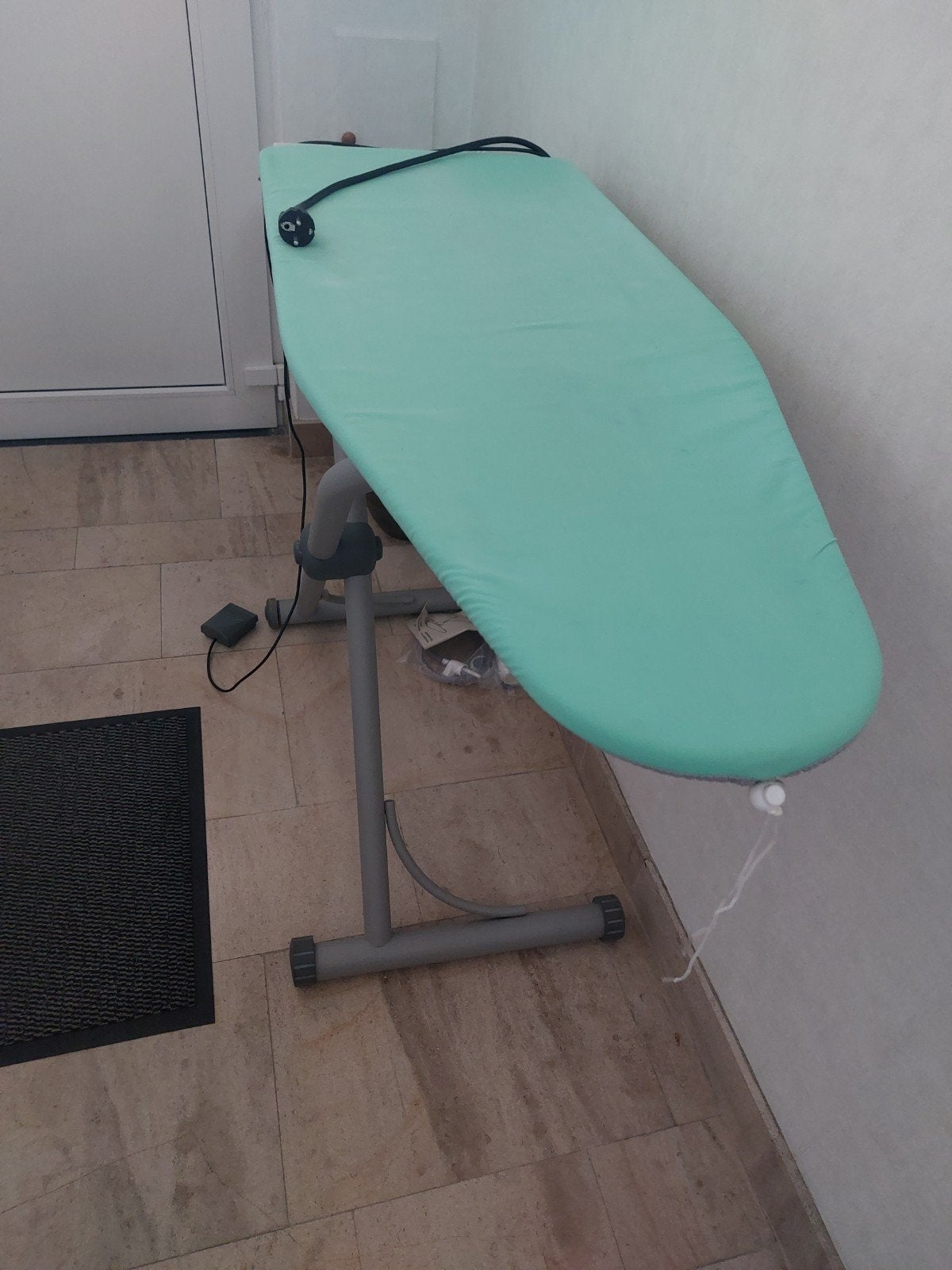 Verwarmde  strijkplank, Ophalen