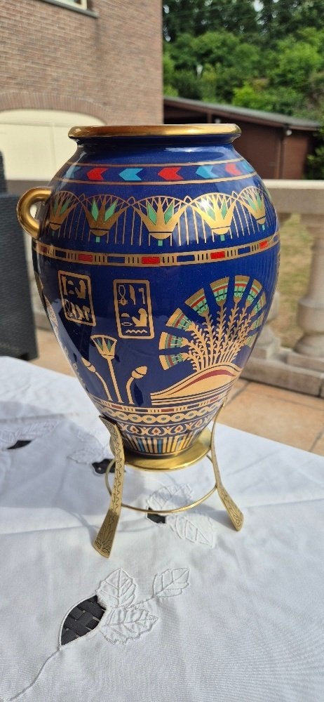de gouden vaas van BAST, Ophalen