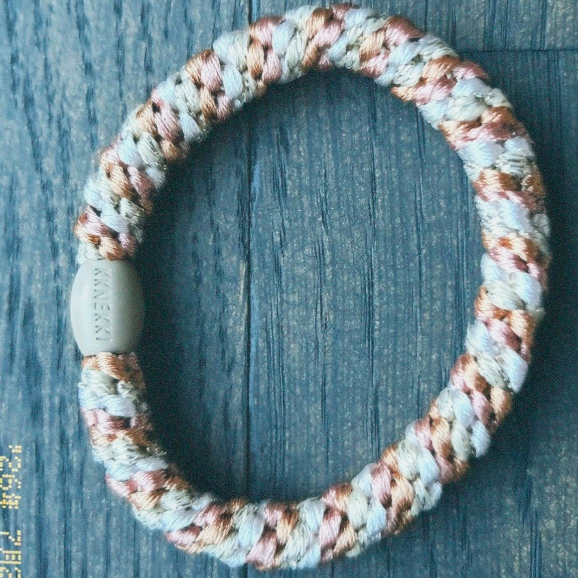 Brons en witte Knekkie., Ophalen of Verzenden, Nieuw, Overige kleuren, Elastiek