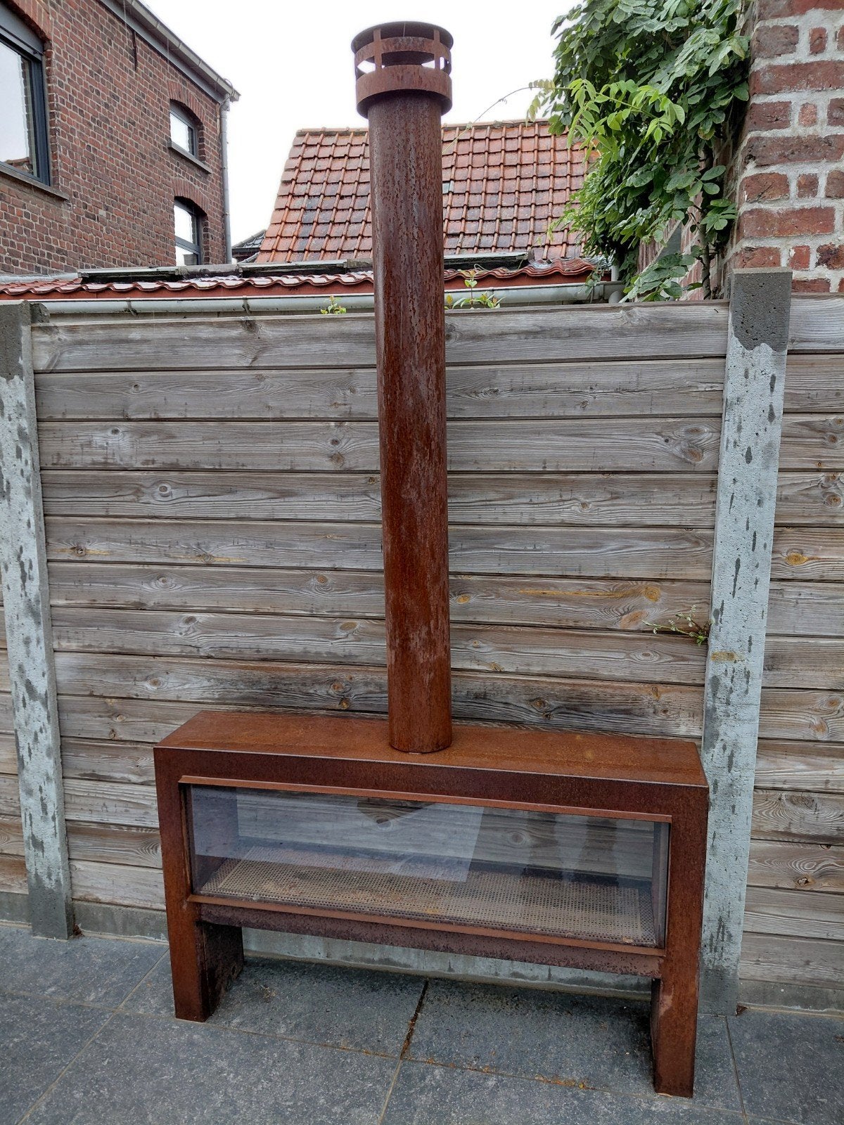 Faber Cortenstaal buitenhaard op hout, Ophalen