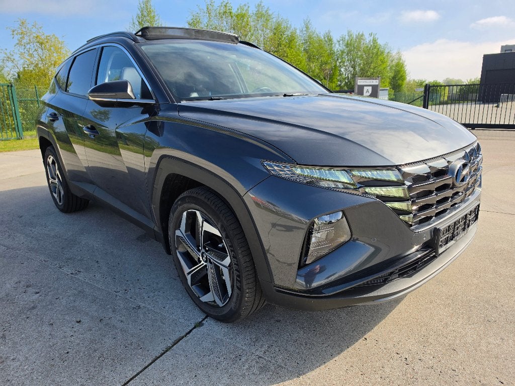 Hyundai Tucson 1.6 T-GDI Hybride Pano Full Option + Garantie, Auto's, Automaat, Leder, Bedrijf, 5 zetels