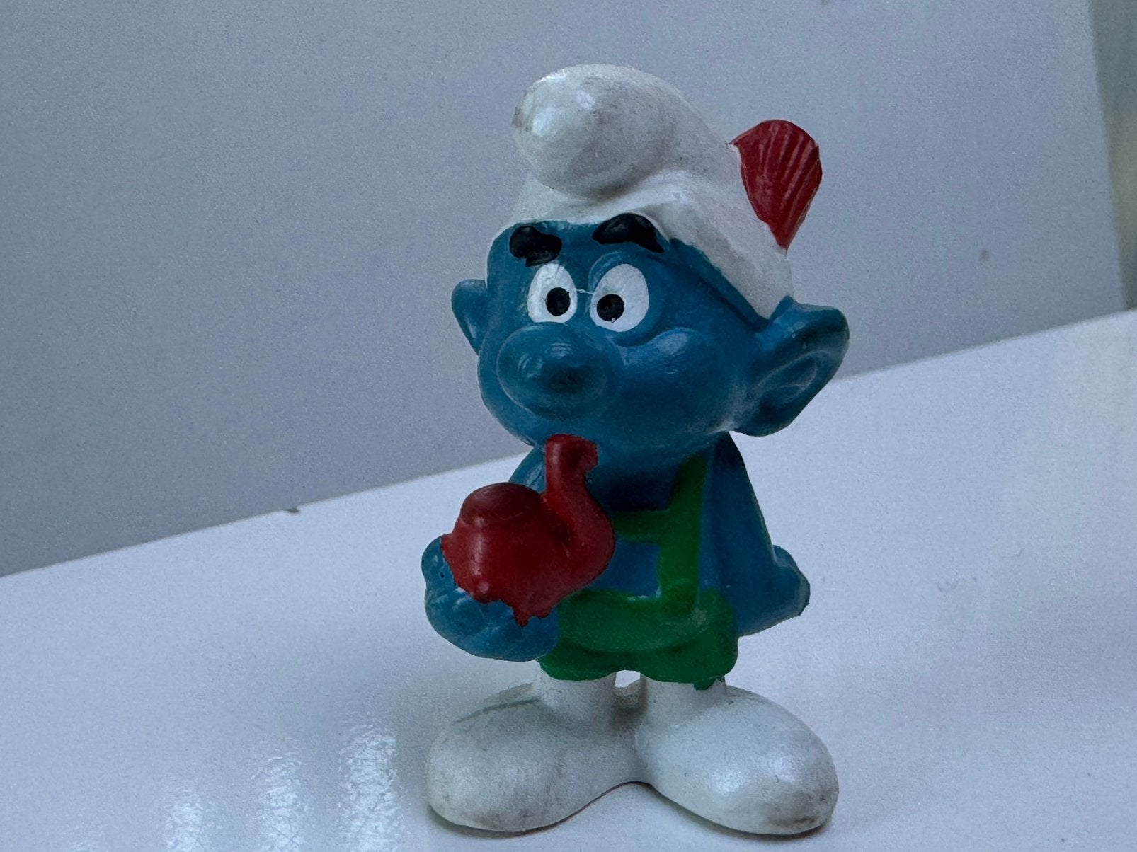 Miniatuur smurf met pijp, Collections, Schtroumpfs, Enlèvement ou Envoi, Utilisé, Autres Schtroumpfs, Poupée, Figurine ou Peluche