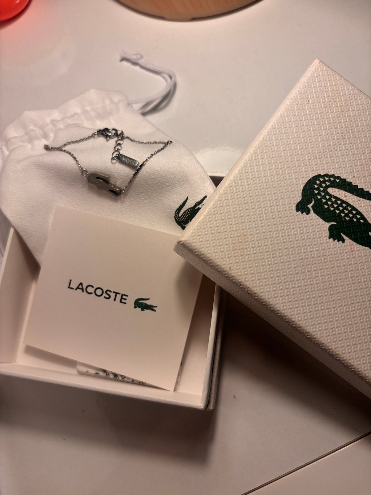 Lacoste armband UNISEX, Ophalen of Verzenden, Zo goed als nieuw, Grijs, Zilver