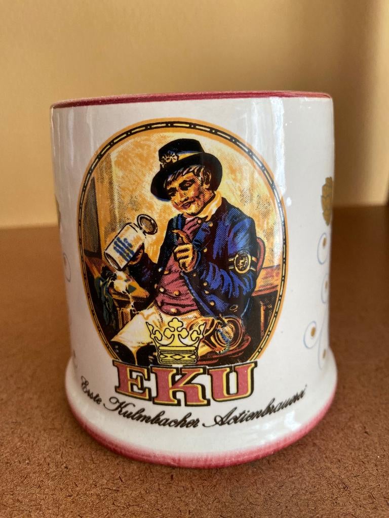 Chope en céramique bière  " EKU ", Collections, Marques de bière, Enlèvement ou Envoi, Neuf, Chope(s)