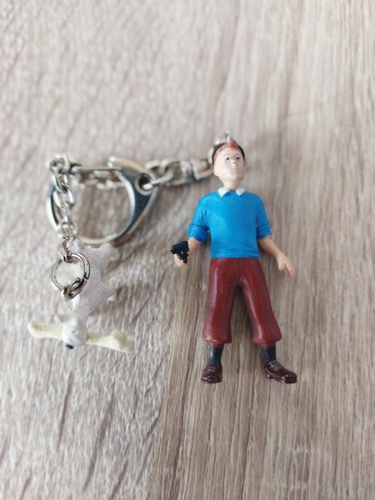 Porte clef Tintin armé et Milou. Parfait état., Enlèvement, Neuf, Peluche ou Figurine