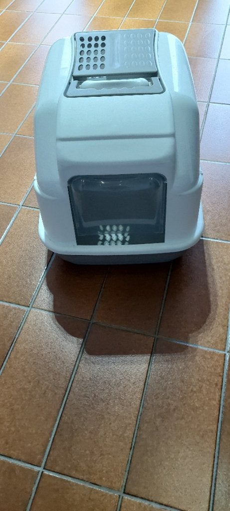 Bac à litière blanc avec tige noire, Enlèvement