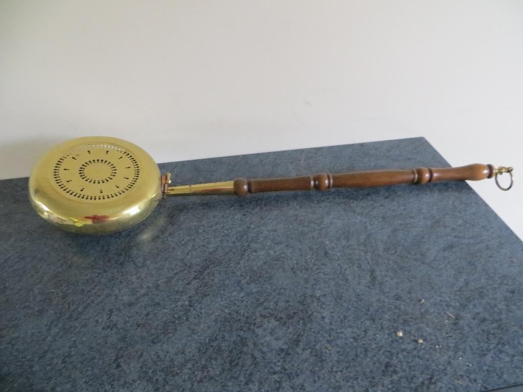 bedverwarmer, Ophalen