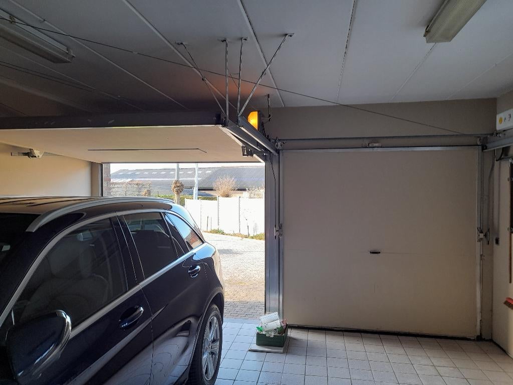 Dubbele garagepoort met elektrische bediening