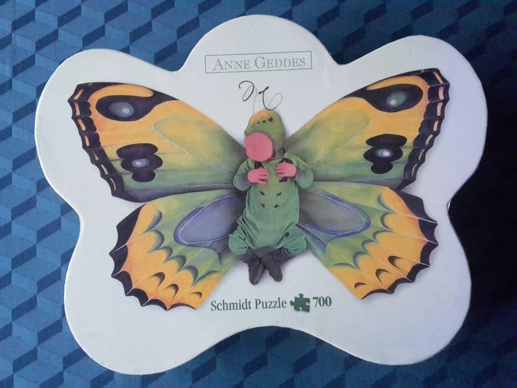 Mooie puzzel: Anne Geddes groen vlinderkind, 700 stukjes, Hobby en Vrije tijd, Ophalen of Verzenden, 500 t/m 1500 stukjes, Zo goed als nieuw