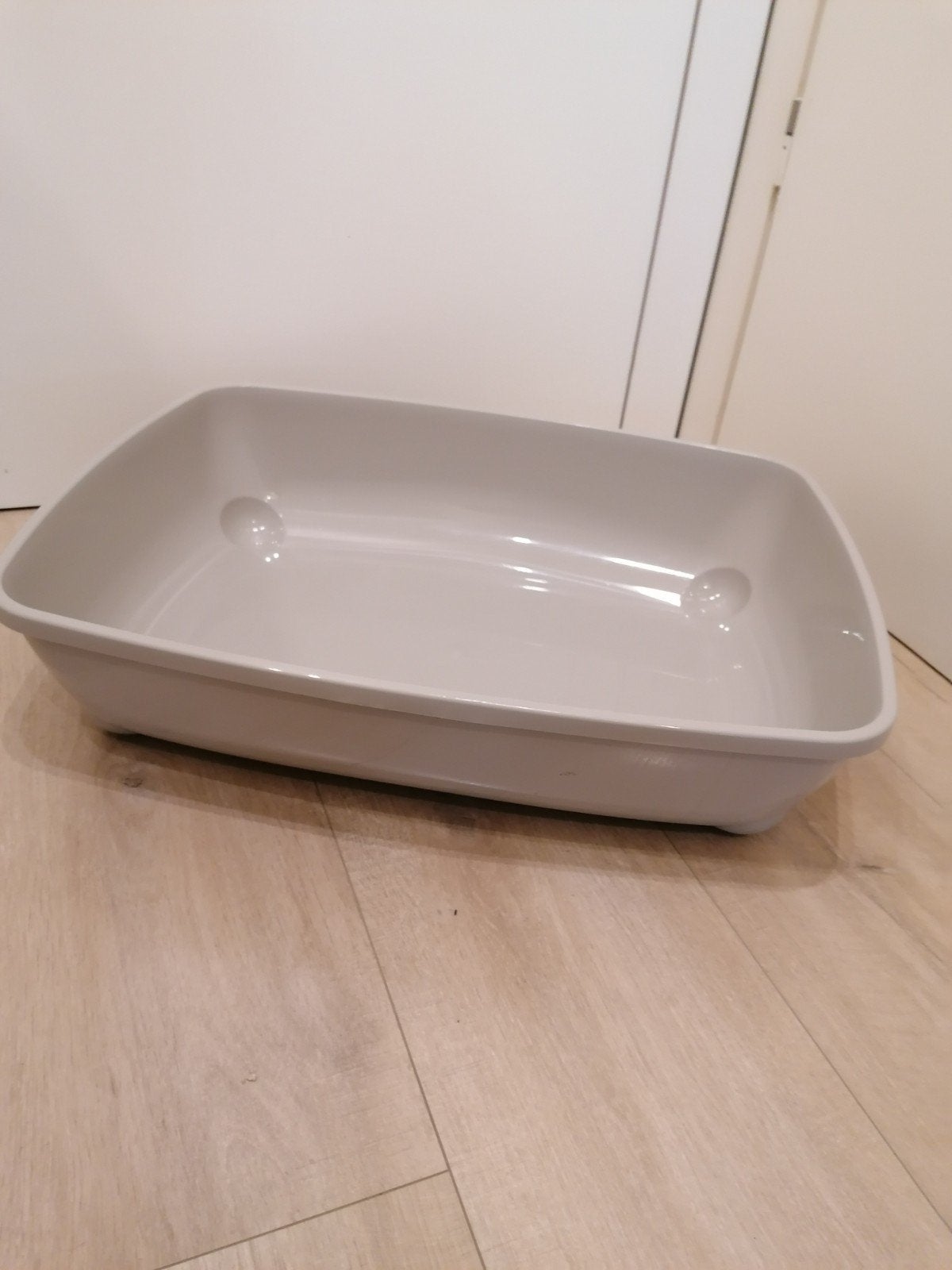 Grote rechthoekige kattenbak, Ophalen