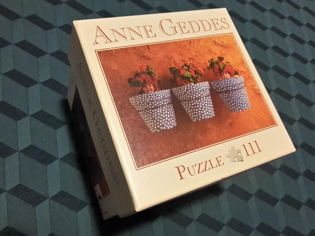 Kleine Anne Geddes puzzle in doosje, als nieuw, 111 stukjes, Enlèvement ou Envoi, Moins de 500 pièces, Comme neuf, Puzzle