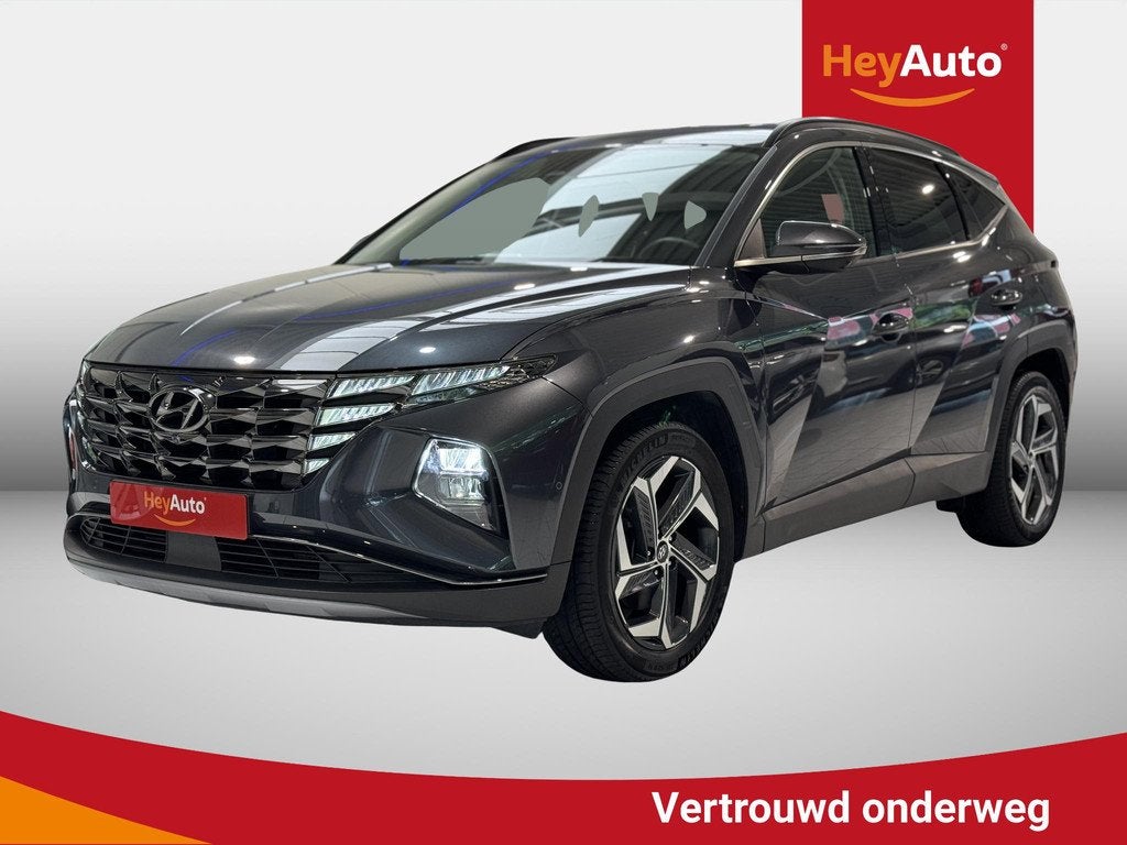 HYUNDAI Tucson HEV 1.6 T-GDI SHINE 2WD 6A/T 1.598CC - 4L -, Auto's, Stof, Gebruikt, 4 cilinders, Blauw