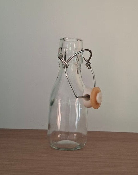 Glazen flesje (13cm) met beugelsluiting, Ophalen of Verzenden, Gebruikt, Kan