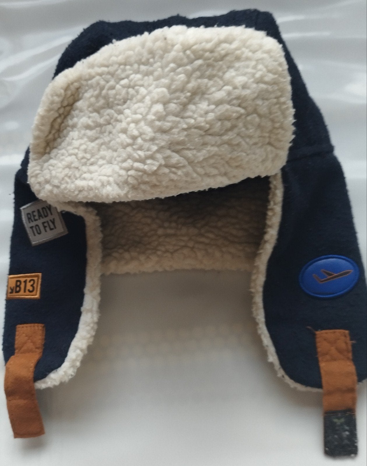 bonnet aviateur doublé Sherpa, Enlèvement