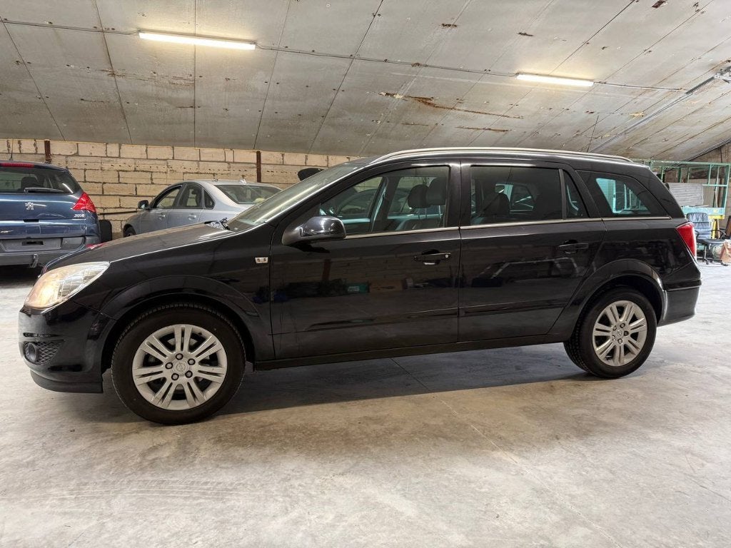 Opel Astra Cosmo 1.3 diesel, 1ste eigenaar,, Voorwielaandrijving, Zwart, 4 cilinders, Leder en Stof