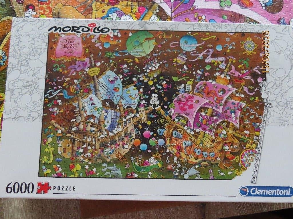 Puzzel 6000 st - Mordillo (van Clementoni), Hobby en Vrije tijd, Denksport en Puzzels, Zo goed als nieuw, Legpuzzel, Meer dan 1500 stukjes