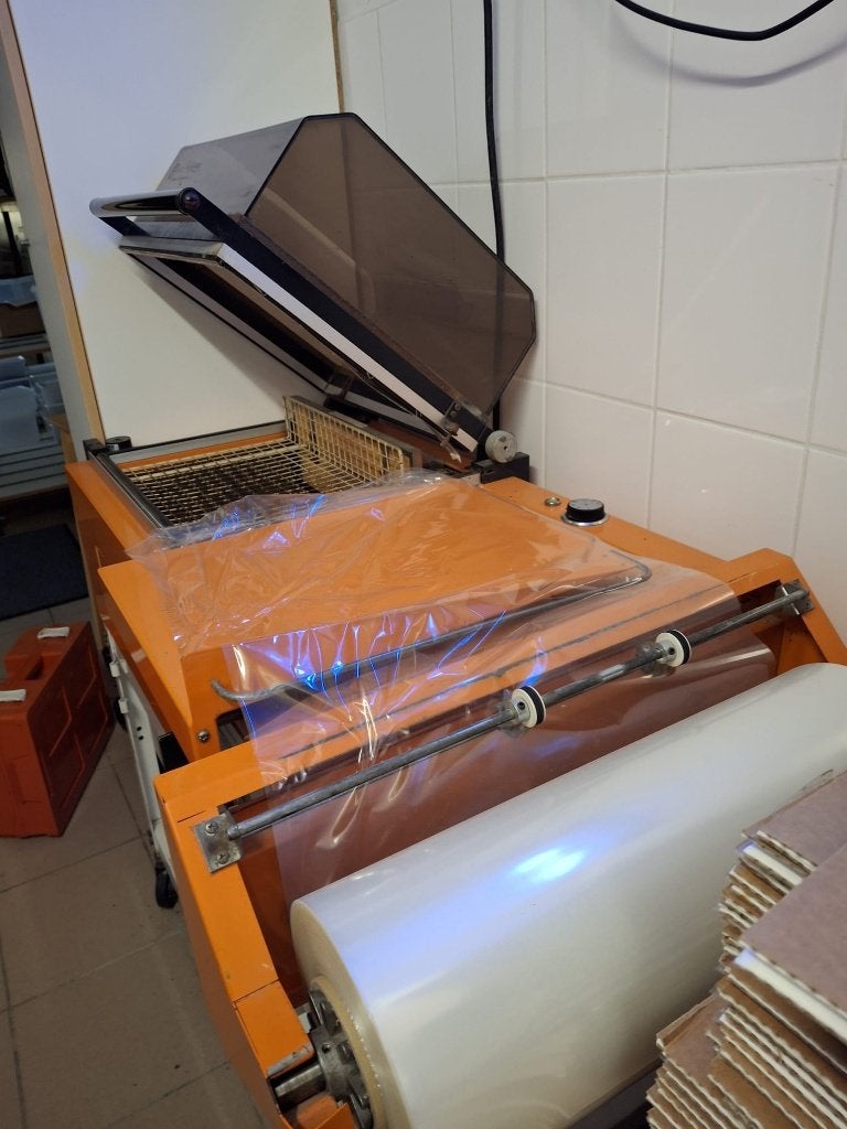 Krimpfoliemachine, Ophalen