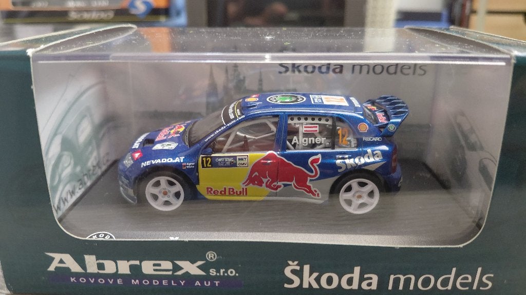 Abrex 1/43 - Skoda Fabia WRC Red Bull - Aigner, Ophalen of Verzenden, Zo goed als nieuw, Auto, Overige merken