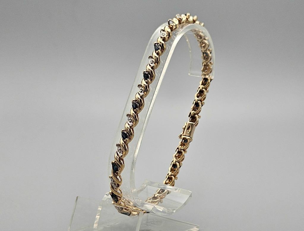 Gouden Vintage tennisarmband met saffier en diamant. 2024/56, Handtassen en Accessoires, Armbanden, Blauw, Ophalen of Verzenden