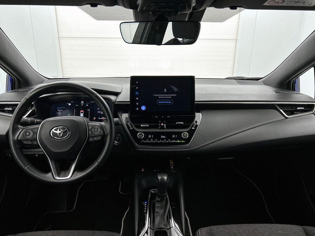Toyota Corolla TS 1.8 Hybrid Dynamic e-CVT | Navigatie | Ach, Auto's, Toyota, Gebruikt, 750 kg, Bedrijf, 5 zetels