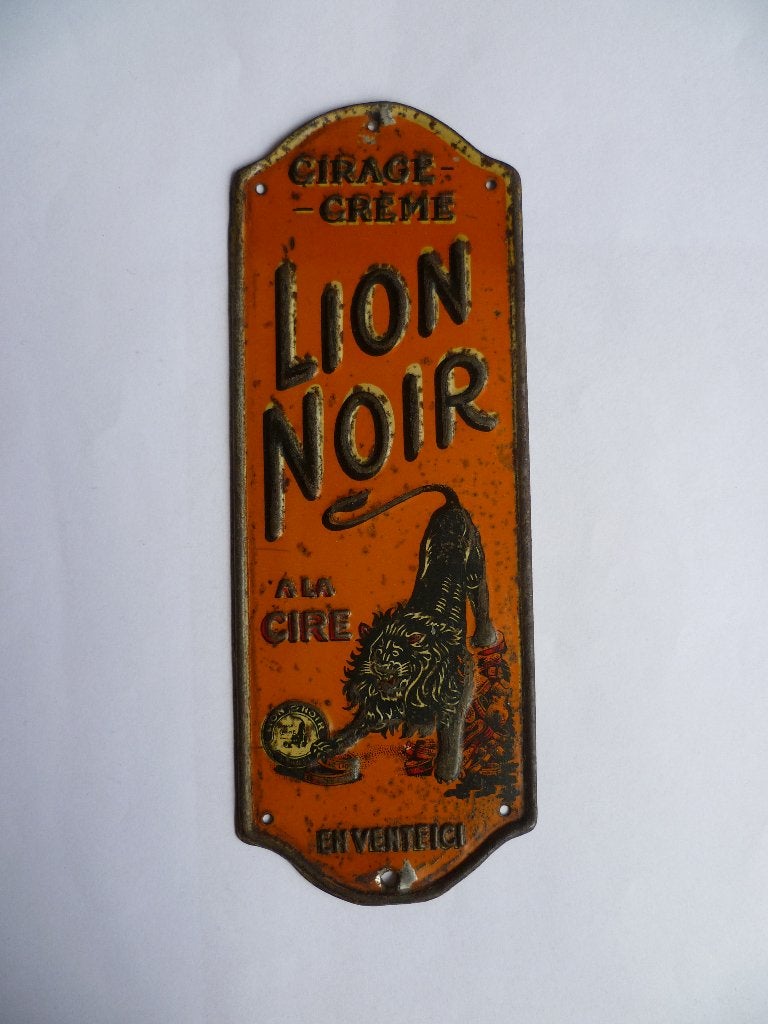 BLIKKEN DEURPOSTJE"LION NOIR EN VENTE ICI"UIT JAREN 30/40, Verzamelen, Ophalen of Verzenden, Gebruikt, Reclamebord