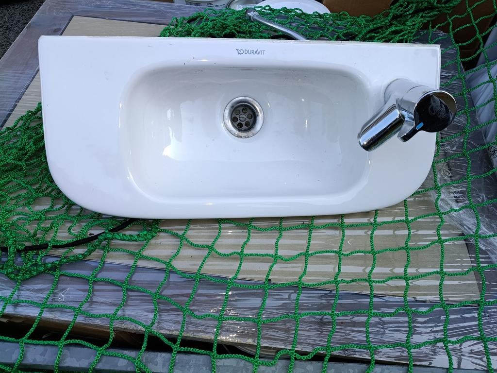 Handenwasser met kraantje, Ophalen
