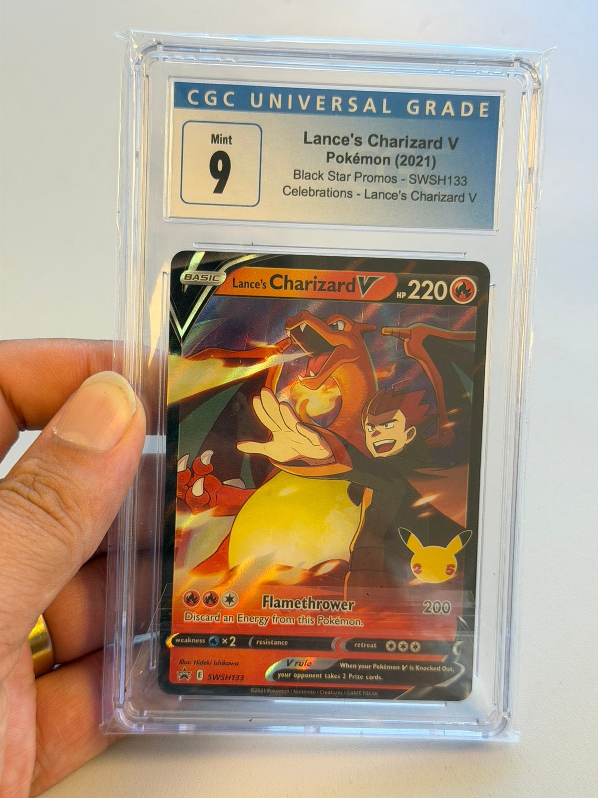Lance’s Charizard V SWSH133 CGC 9 Celebrations Pokémon 2021, Ophalen of Verzenden, Zo goed als nieuw, Losse kaart, Foil