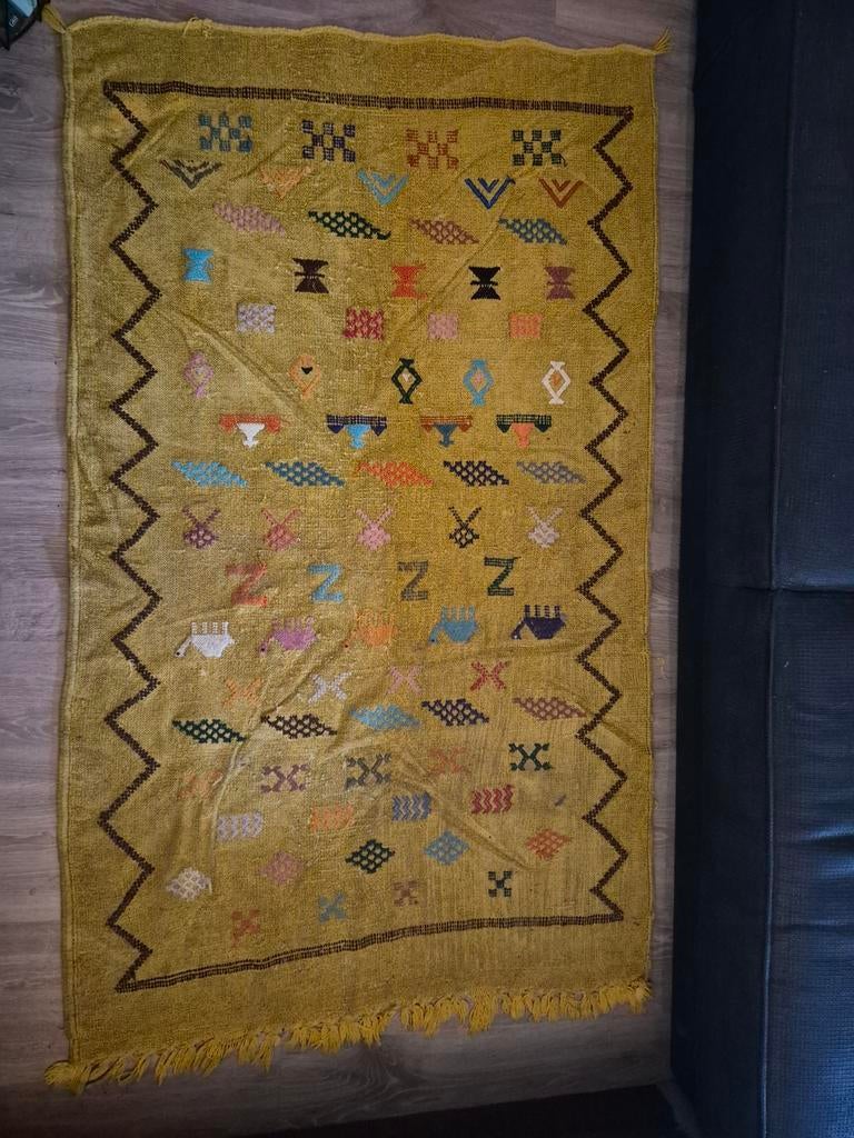 Handgewoven Berbers tapijt, Ophalen