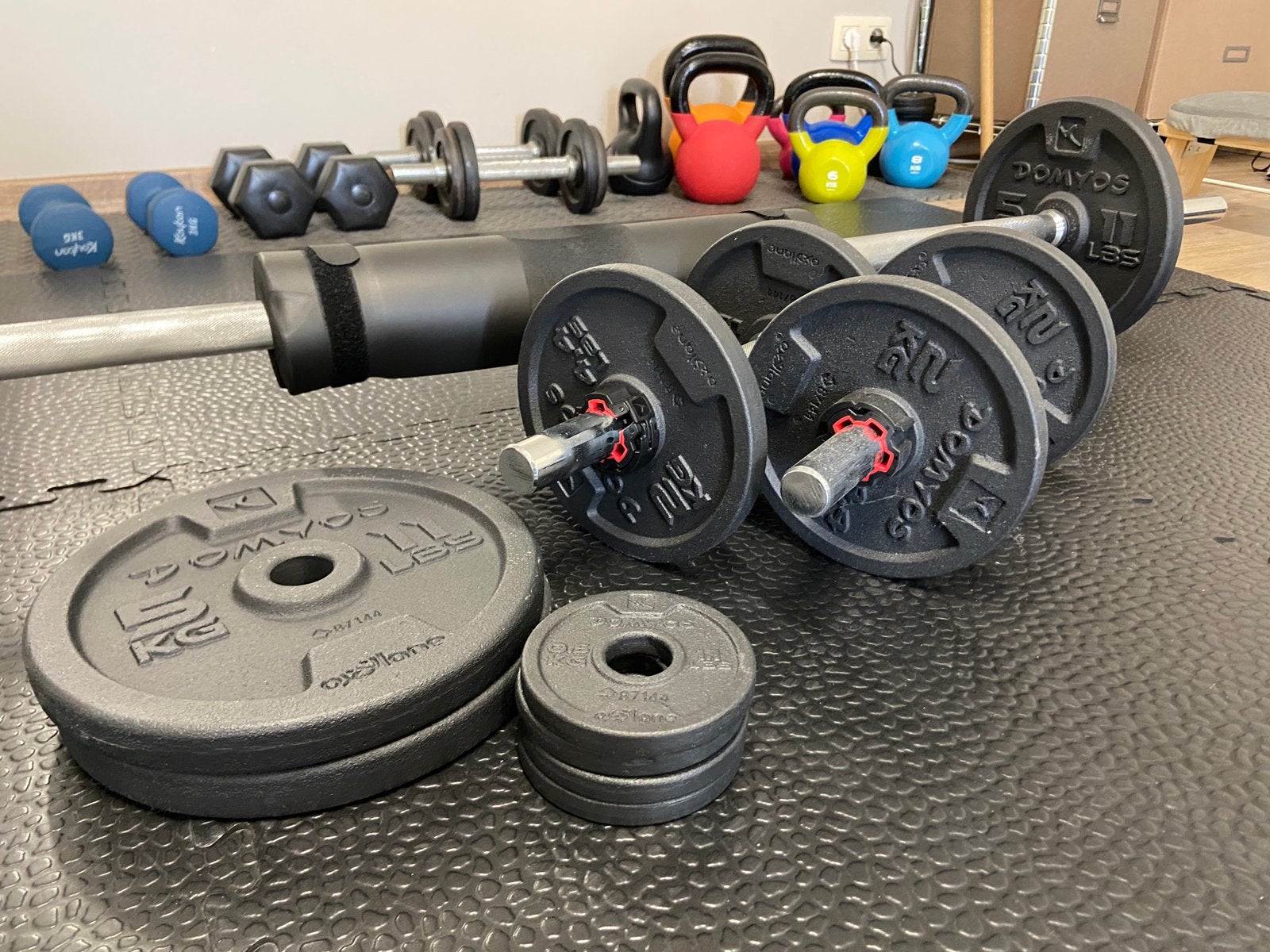 Domyos set met halters, stang en schijven 50kg, Sport en Fitness, Ophalen, Nieuw